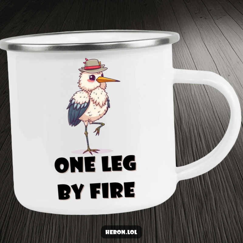 Funny fluffy heron camping mug, standing on one leg, balancing a hat, ideal for outdoor use, an elegant and humorous gift.