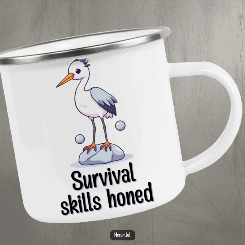 Funny enamel camping mug with a charming illustration of a heron attempting to juggle three shiny stones with its legs, perfect for the outdoors.