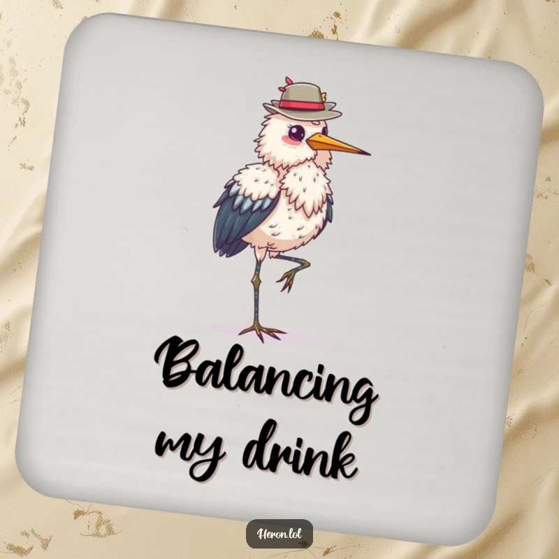 Funny fluffy heron coaster, standing on one leg, balancing a hat, protects surfaces, adds elegant humor to any setting, a stylish gift.
