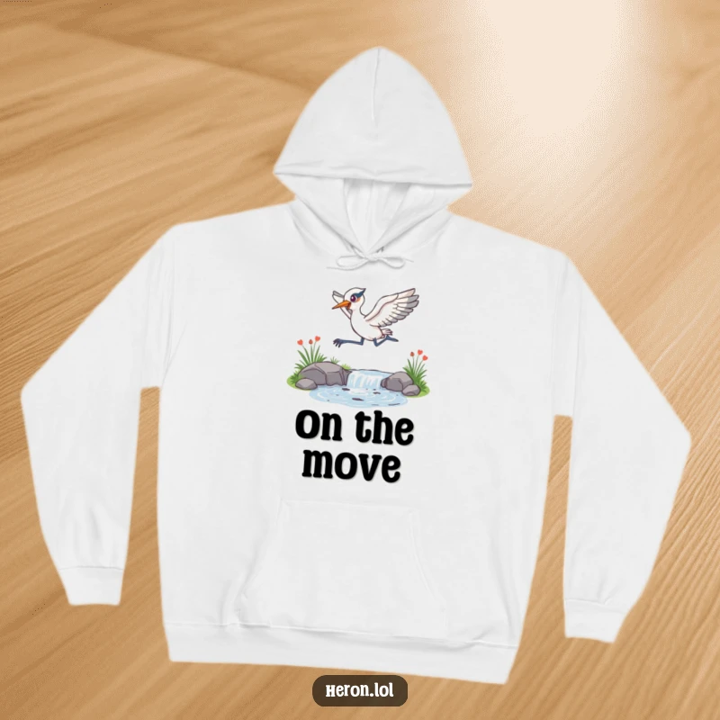 Funny Hoodie with an energetic heron leaping over a sparkling stream, conveying a sense of freedom and joyful motion.