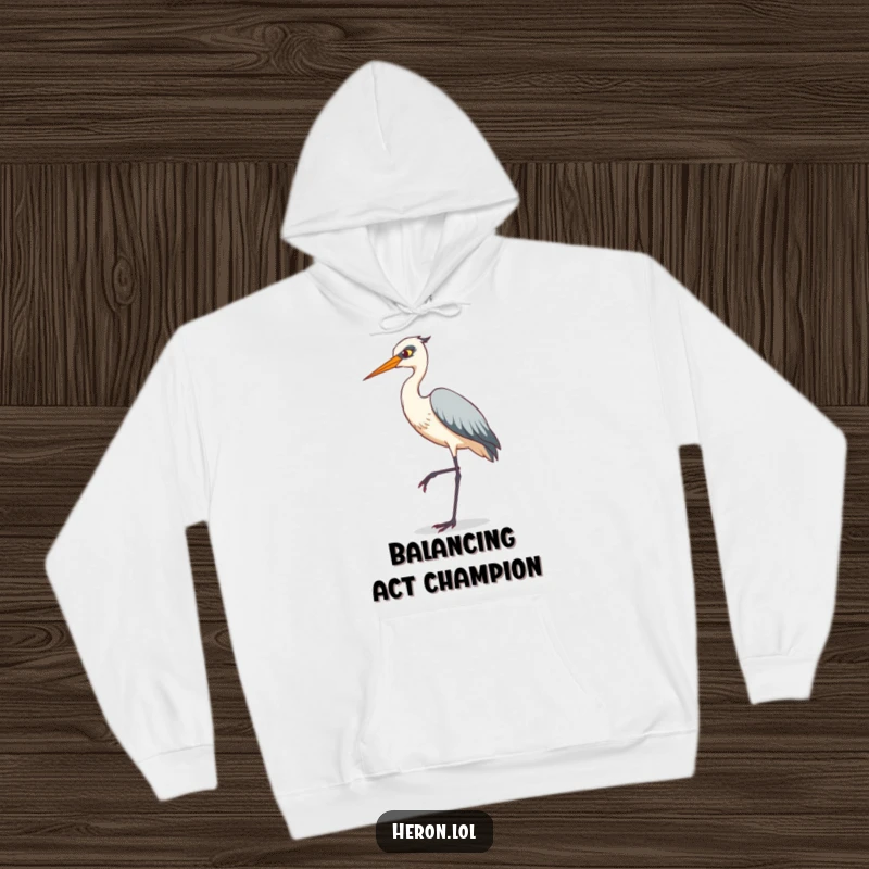 Funny hoodie depicting a heron striking a comical tiptoe pose on a single, thin leg, offering warmth and a dose of feathered fun.