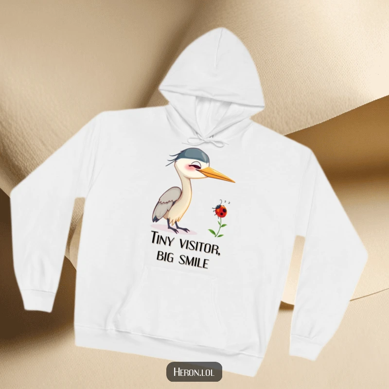 Funny Smiling Heron Hoodie: Gentle heron bird smiling with a ladybug on its neck, offering a humorous and comforting embrace.