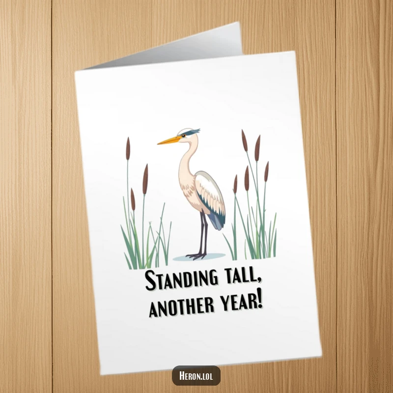 Free Printable Birthday Card: Majestic Heron Stands Tall and Serene Amidst Reeds, Wishing You Peace.
