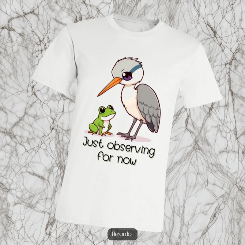 Funny Heron and Frog T-Shirt: Curious heron bird tilts head, watching a tiny frog, wildlife humor, funny gift.