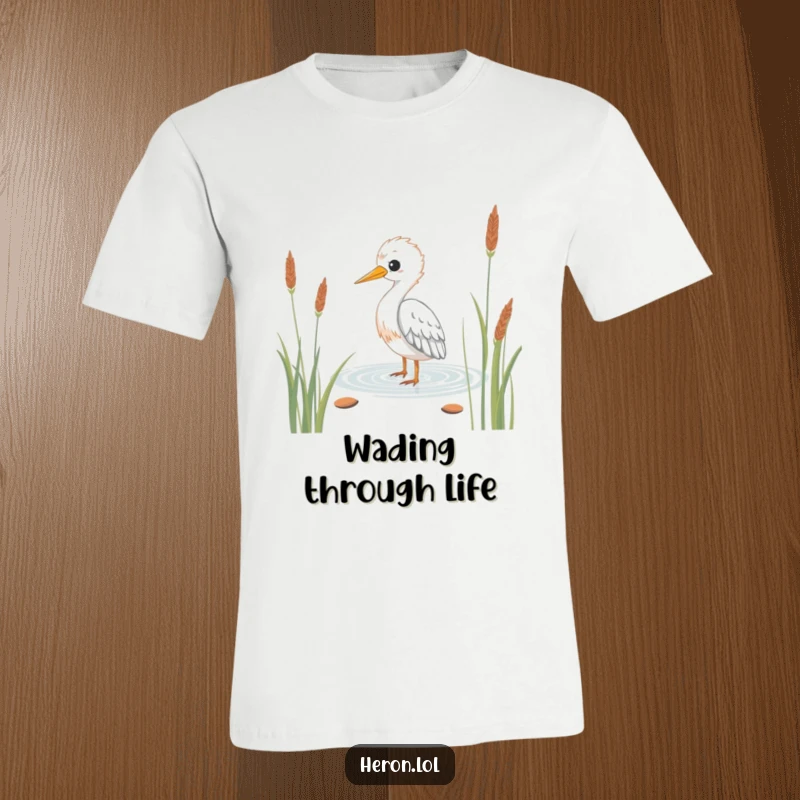 Funny Kawaii Heron T-Shirt: Adorable bird wading peacefully through reeds, conveying gentle humor and calm.