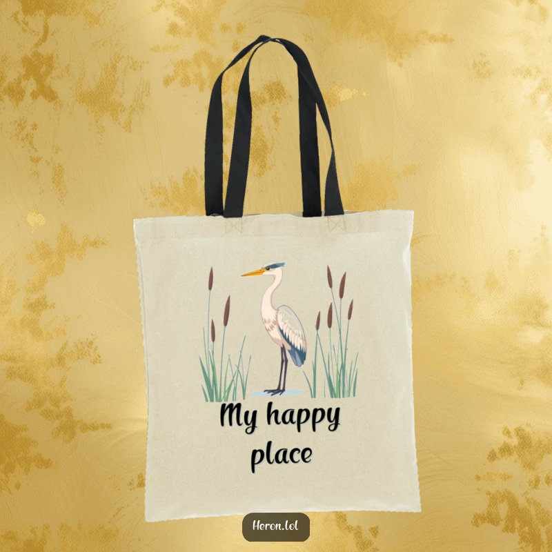 Serene tote bag featuring a majestic heron bird standing tall amidst tall reeds, a beautiful and functional nature accessory.